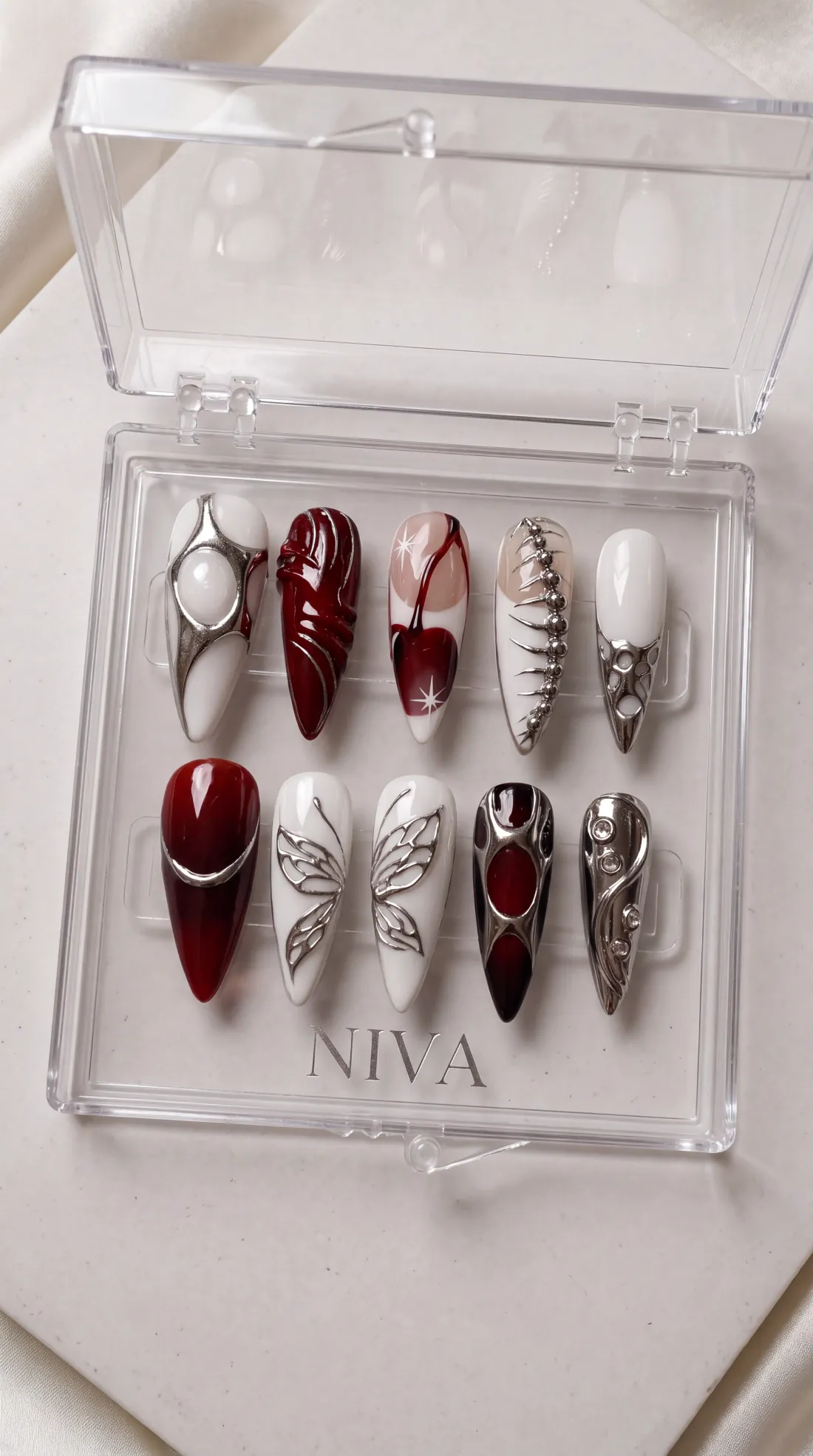 Charm press-on nails in their case