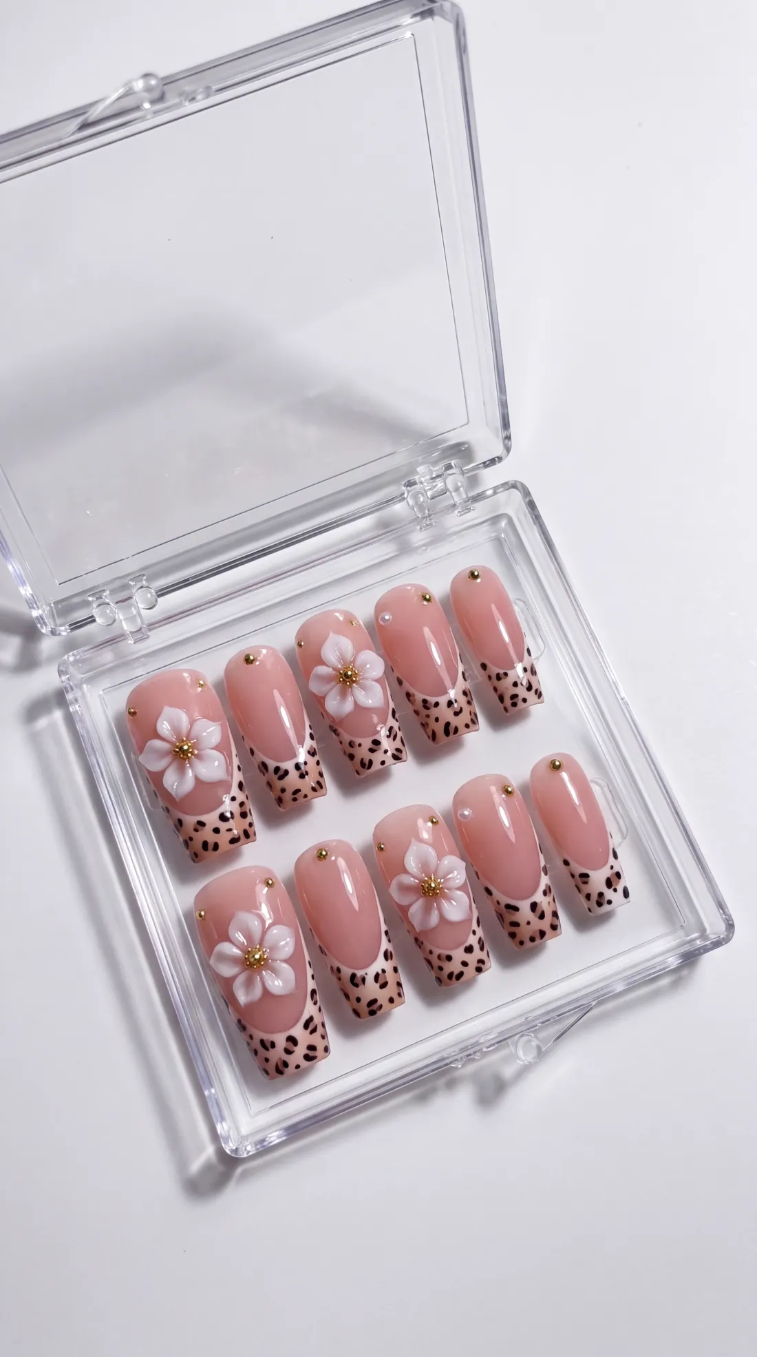 Classic press-on nails in their case