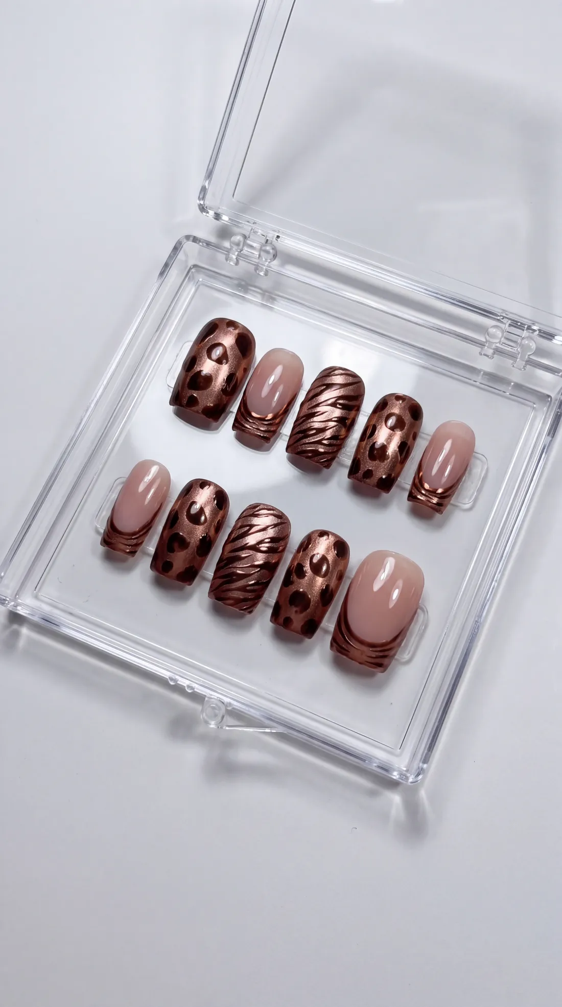 Connector press-on nails in their case