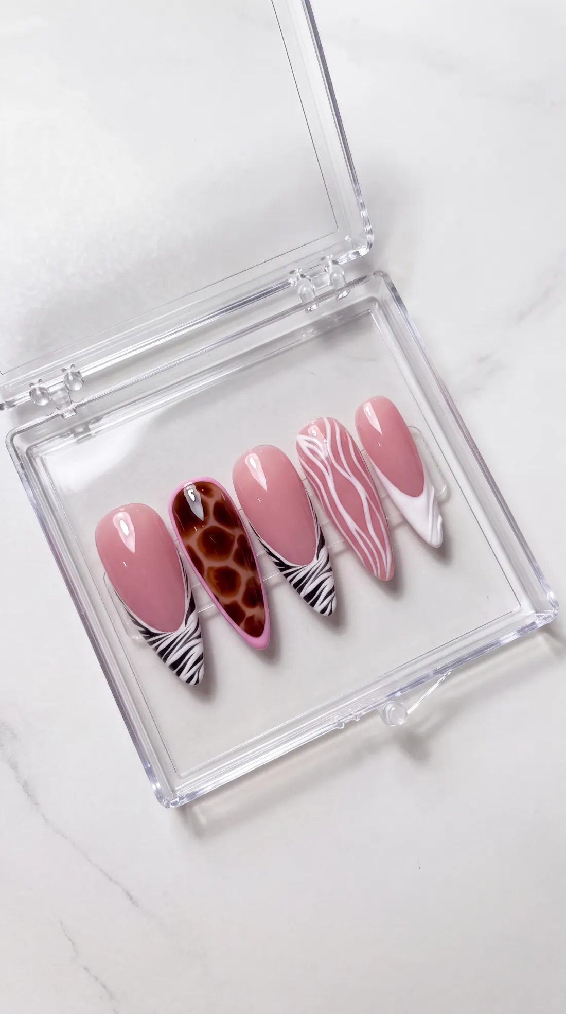 Deadline press-on nails in their case