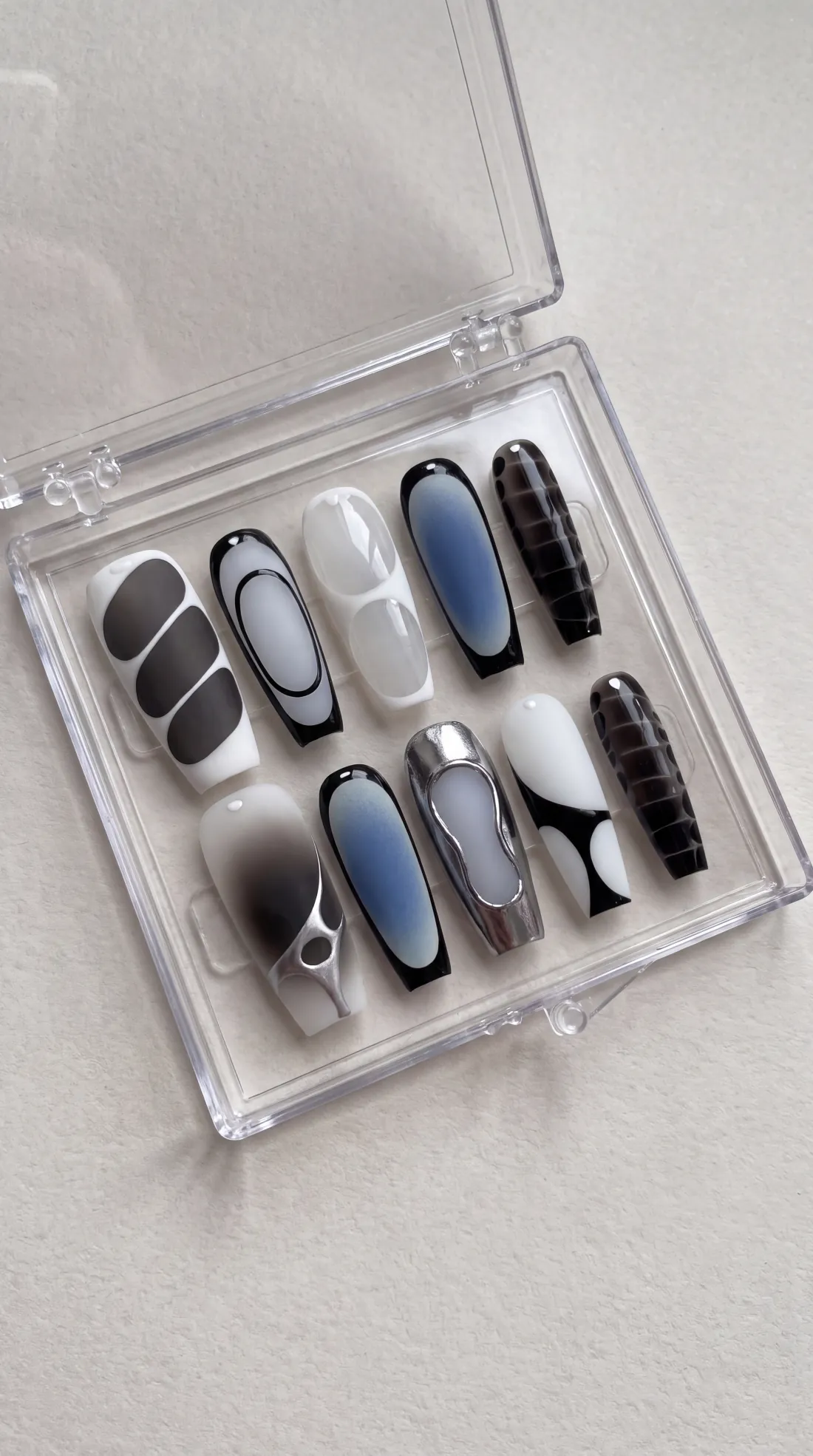 Fever press-on nails in their case