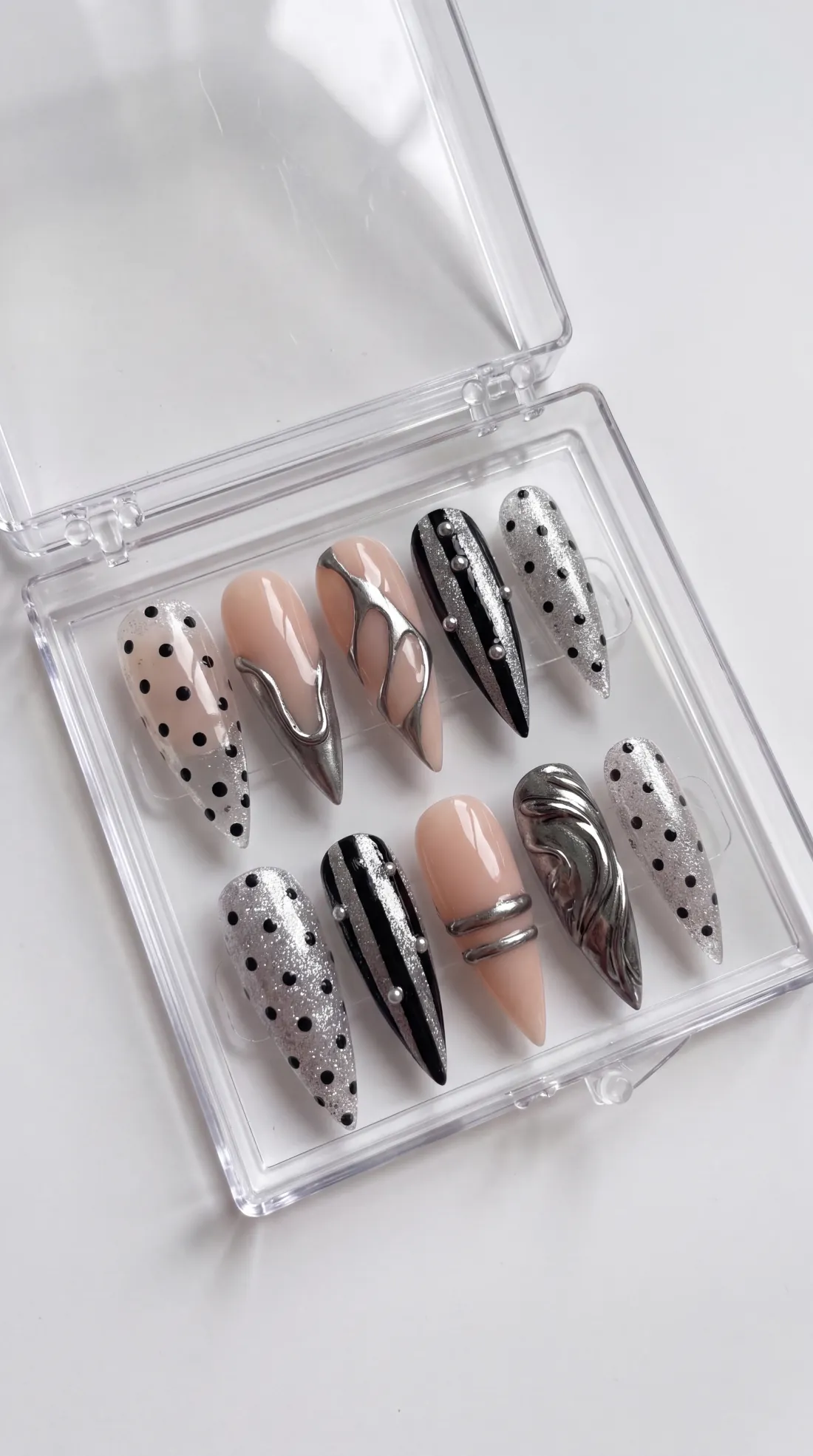 Level Up press-on nails in their case