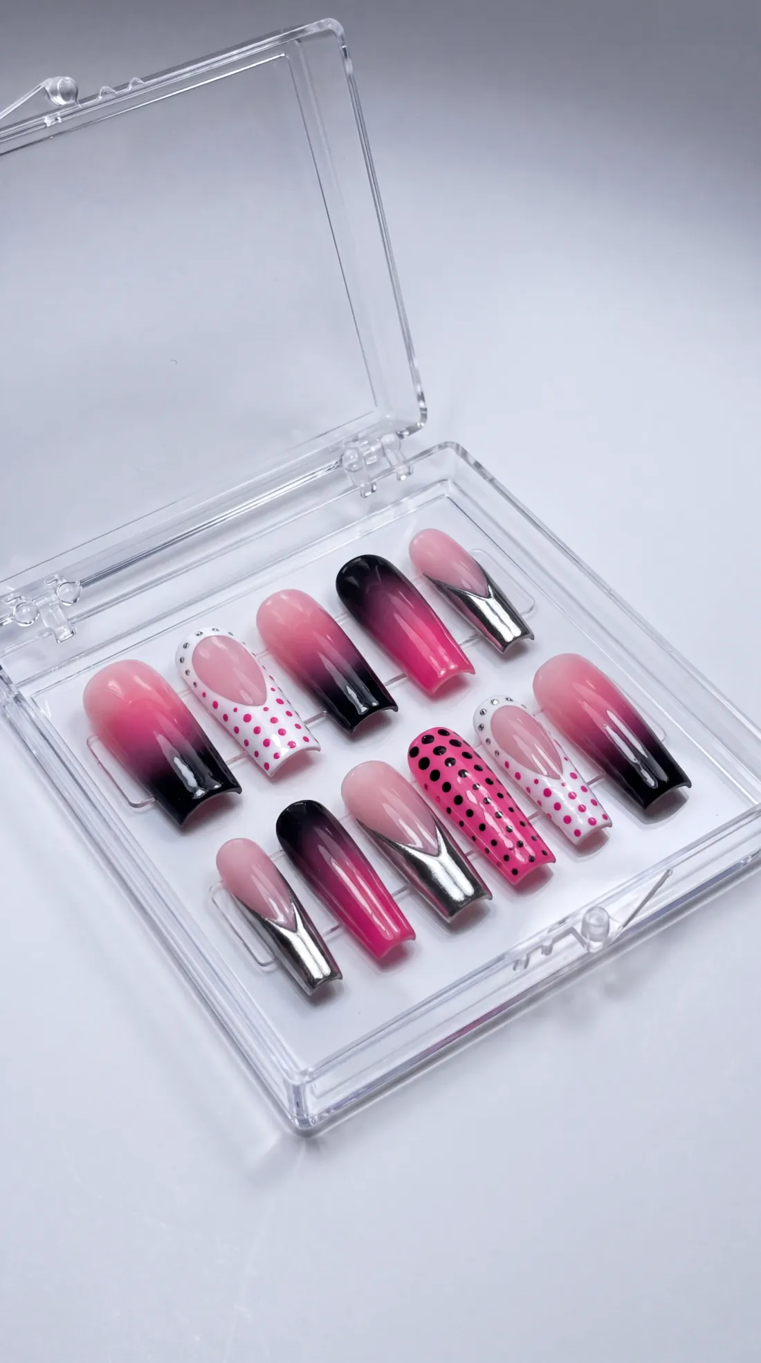 Spotlight press-on nails in their case