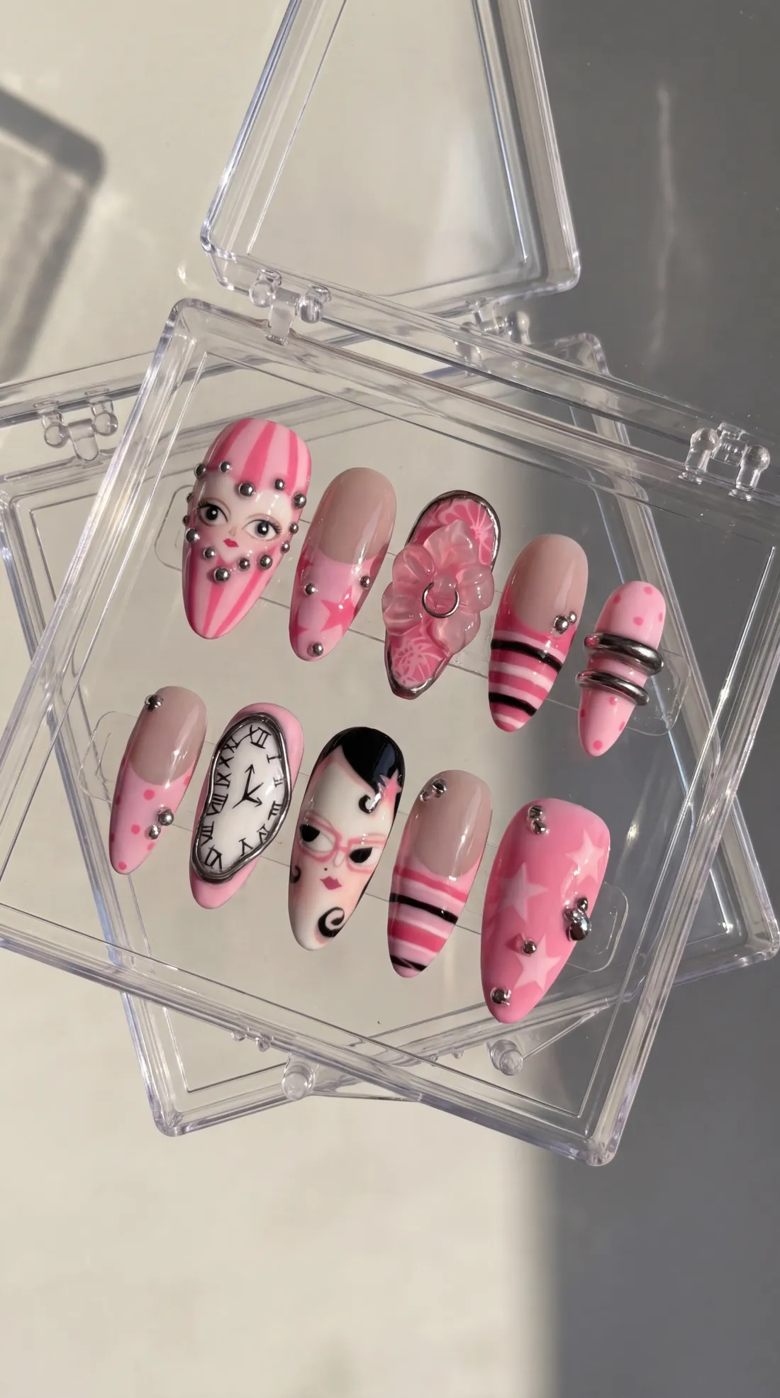 Ticking press-on nails in their case
