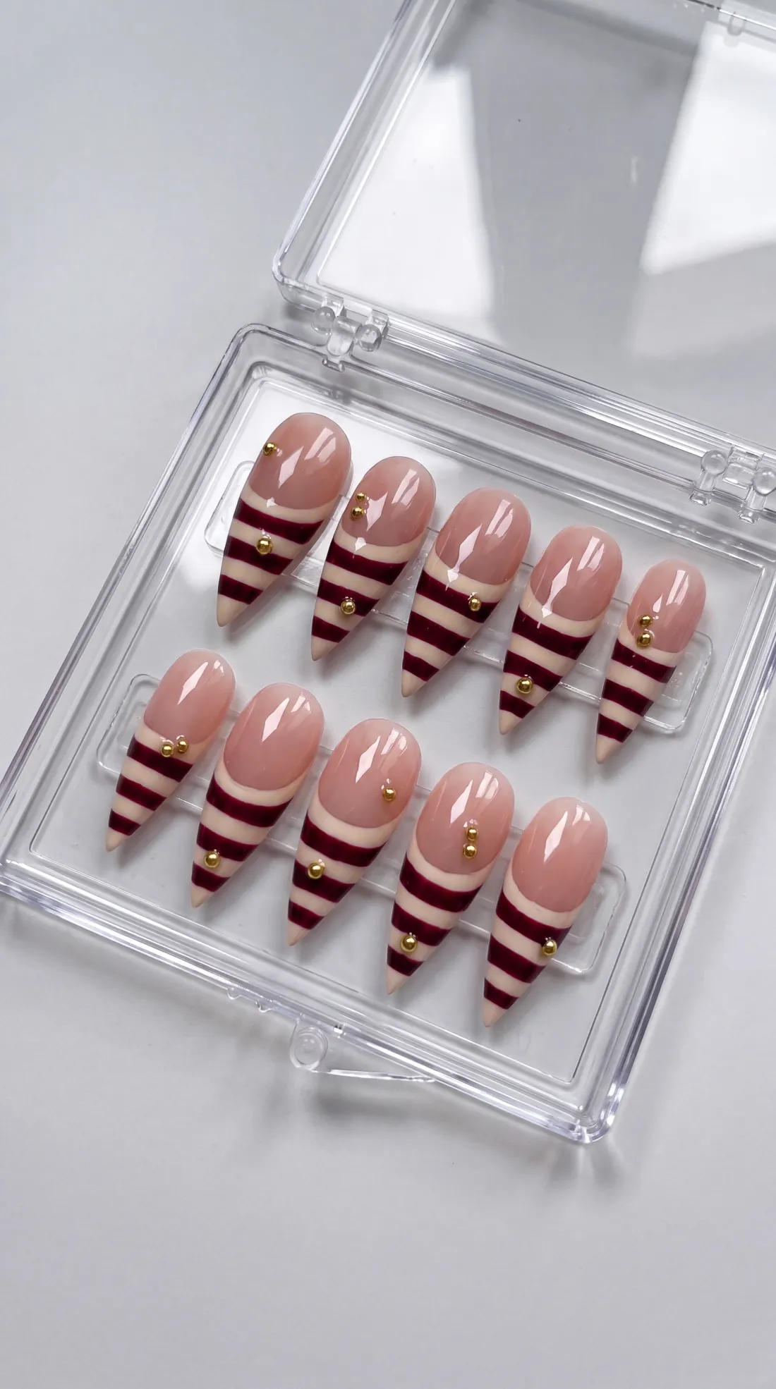 Tour Girl press-on nails in their case